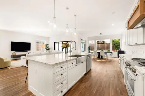 a bedroom with a large bed and a large window