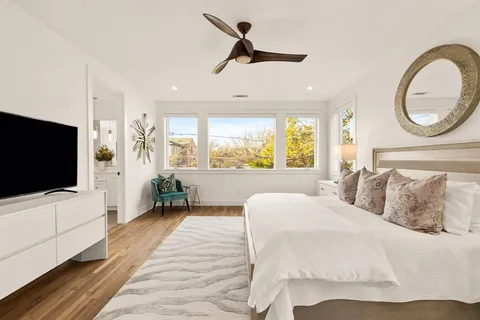 a room with a dresser and a window