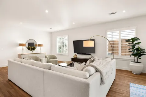 a kitchen with stainless steel appliances granite countertop a sink and cabinets