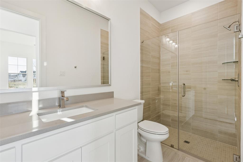 4050 Gambel Road Prosper, TX 75078 - Photo 23 of 23 Friends and family will feel right at home in any of the beautifully finished guest baths in our Stella floor plan.