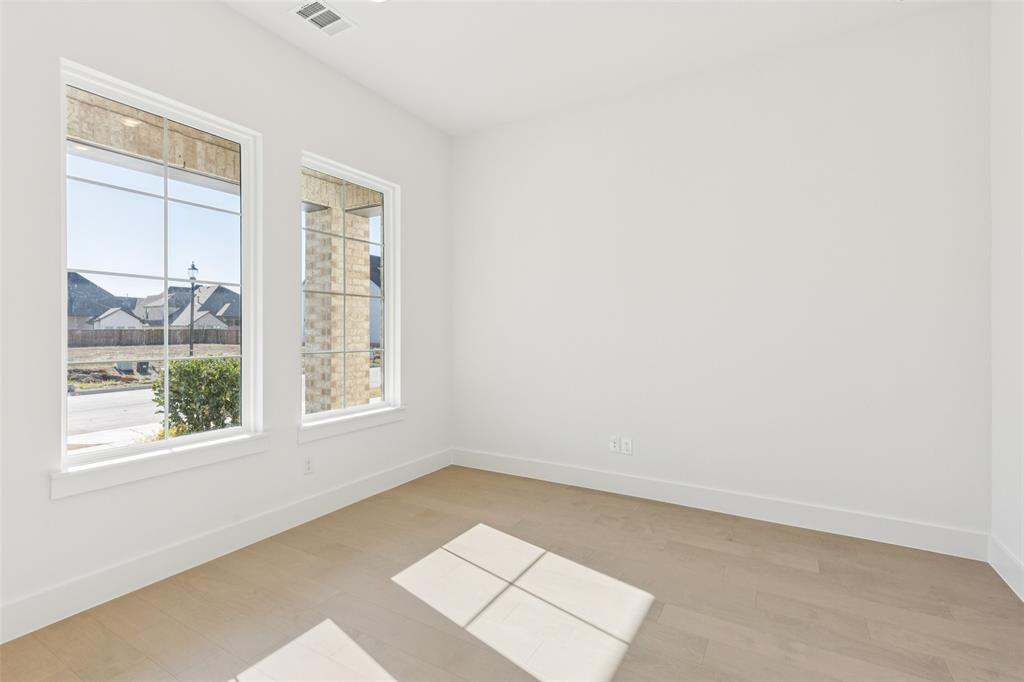 4050 Gambel Road Prosper, TX 75078 - Photo 4 of 23 Your peaceful, light filled home office is located at the front of this beautiful home and offers privacy for those needing to work from home.