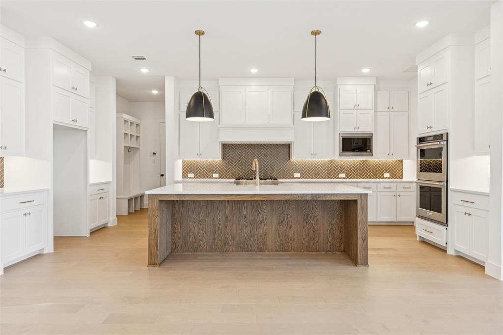 4050 Gambel Road Prosper, TX 75078 - Photo 7 of 23 With fantastic style, prep and storage space, all the cooks in the family will love this ourstanding kitchen!