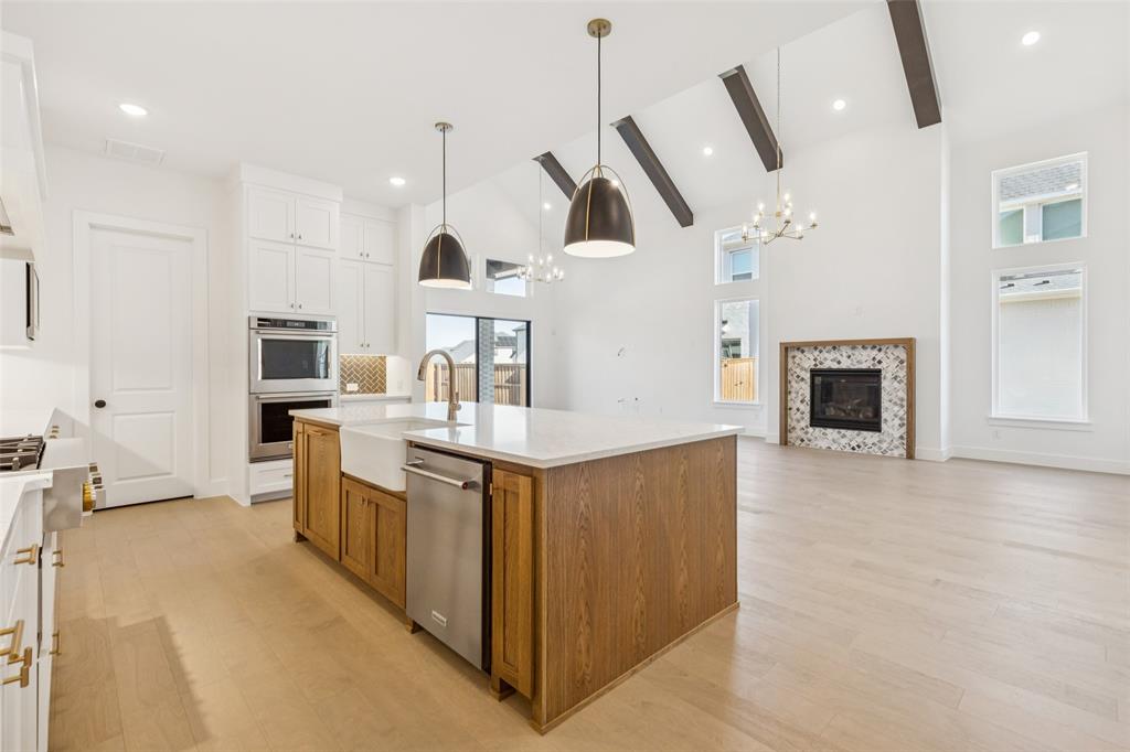 4050 Gambel Road Prosper, TX 75078 - Photo 8 of 23 The chefs in the family will never be left out of the party in this wonderfully designed open concept home.