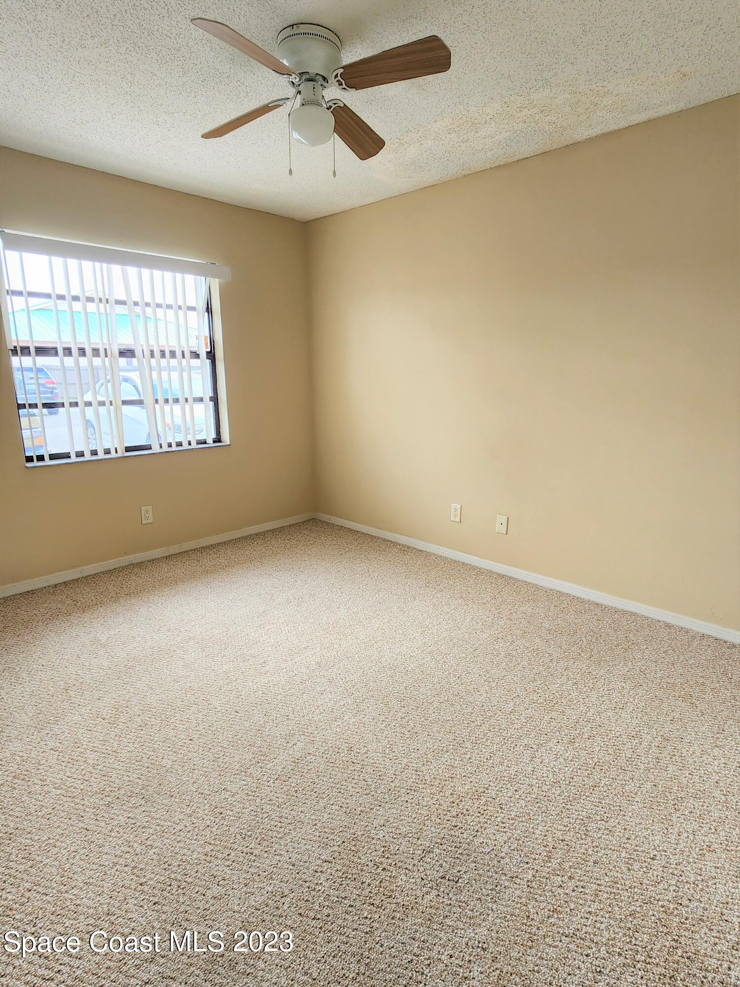 2939 Regency Drive Melbourne, FL 32935 - Photo 17 of 39 an empty room with a window