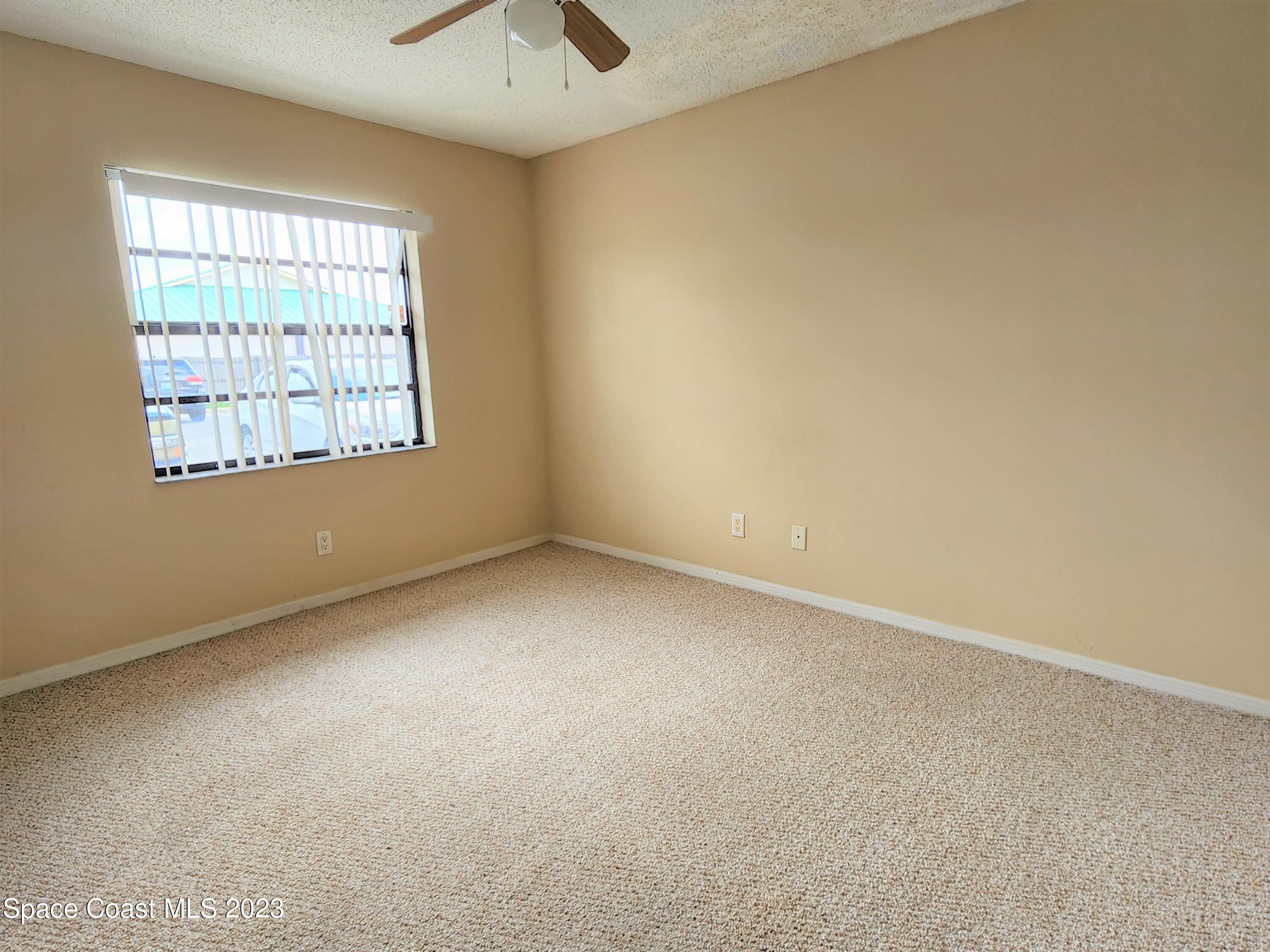 2939 Regency Drive Melbourne, FL 32935 - Photo 18 of 39 an empty room with a window