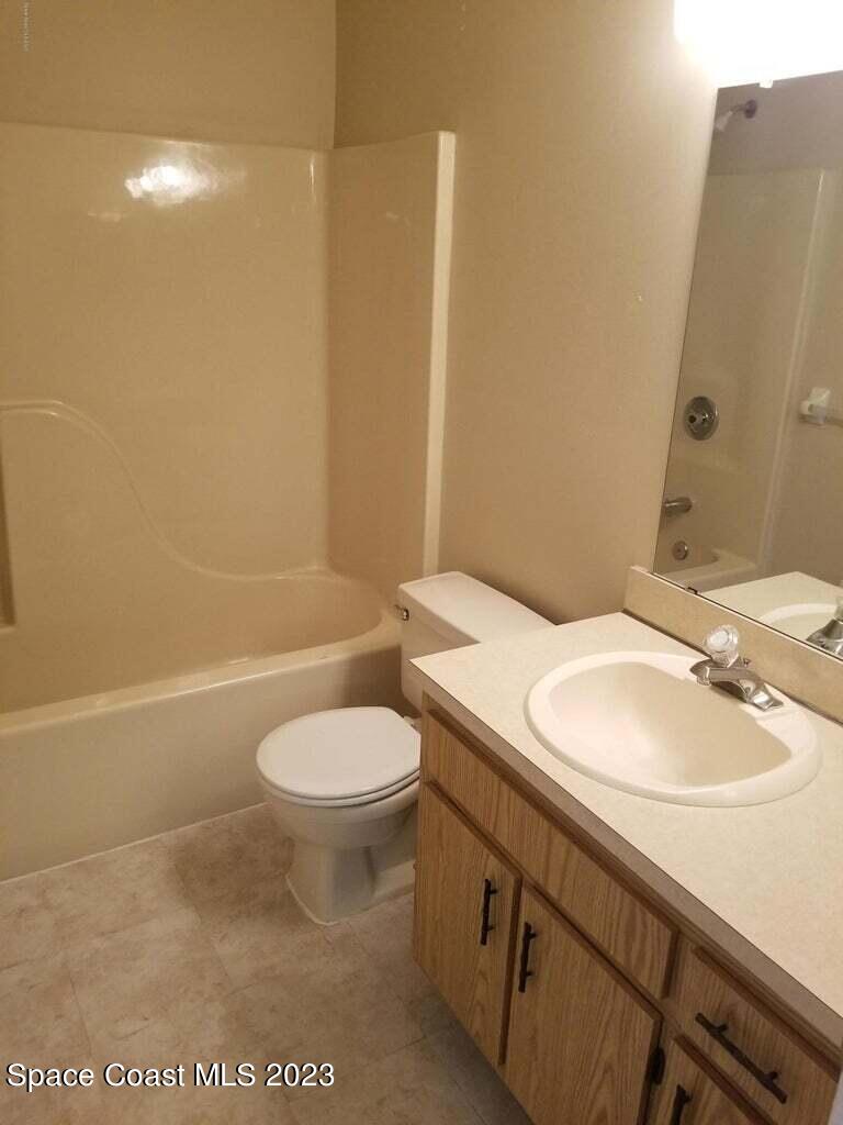 2939 Regency Drive Melbourne, FL 32935 - Photo 24 of 39 a bathroom with a sink a toilet and shower