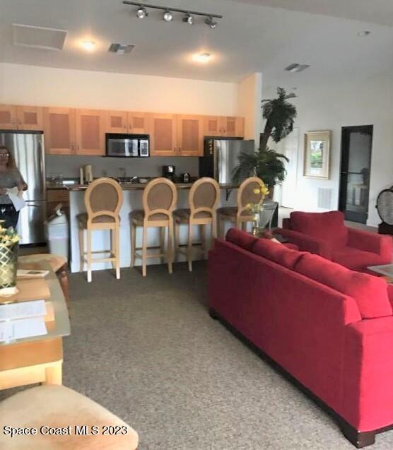 2939 Regency Drive Melbourne, FL 32935 - Photo 28 of 39 a living room with patio furniture and a chandelier