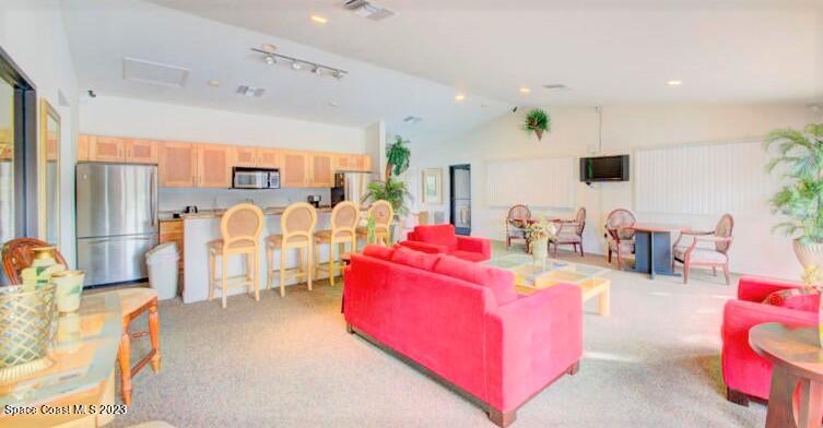 2939 Regency Drive Melbourne, FL 32935 - Photo 29 of 39 a living room with furniture and a flat screen tv