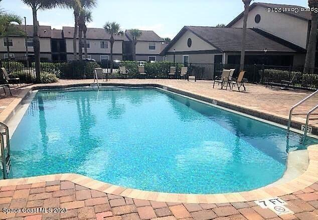 2939 Regency Drive Melbourne, FL 32935 - Photo 3 of 39 a swimming pool with outdoor seating yard and barbeque oven