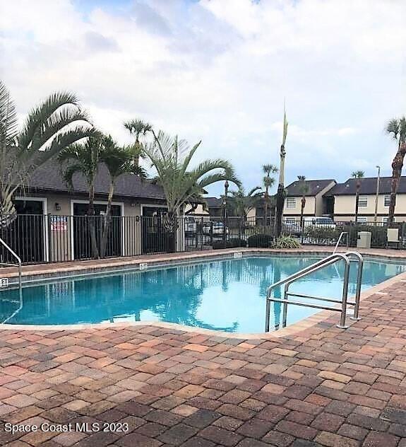 2939 Regency Drive Melbourne, FL 32935 - Photo 36 of 39 a view of a swimming pool with a lake view