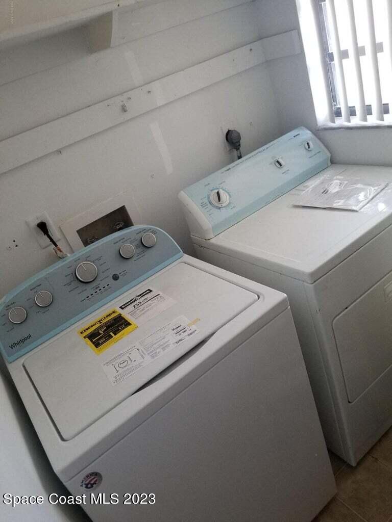 2939 Regency Drive Melbourne, FL 32935 - Photo 39 of 39 a utility room with dryer and washer