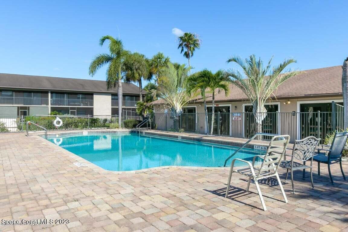2939 Regency Drive Melbourne, FL 32935 - Photo 4 of 39 a view of a house with a swimming pool and a porch