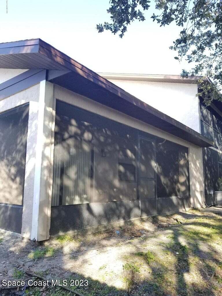 2939 Regency Drive Melbourne, FL 32935 - Photo 5 of 39 a view of back yard of the house