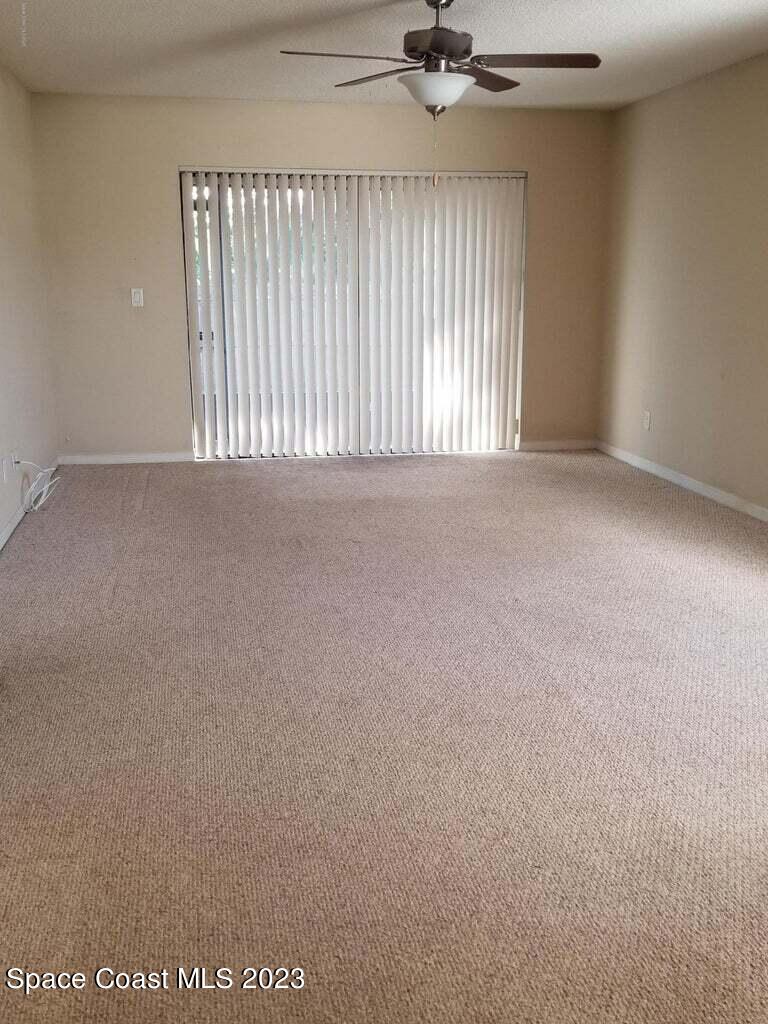 2939 Regency Drive Melbourne, FL 32935 - Photo 7 of 39 a view of an empty room with a window
