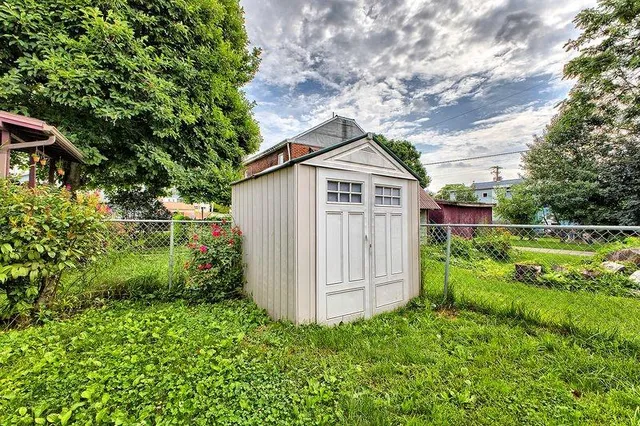 a house with trees in the background