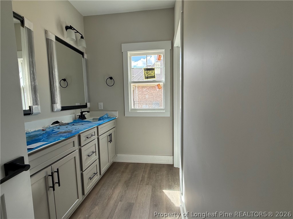 132 Ridge Stone Drive Autryville, NC 28318 - Photo 20 of 26 a spacious bathroom with a double vanity sink and a mirror