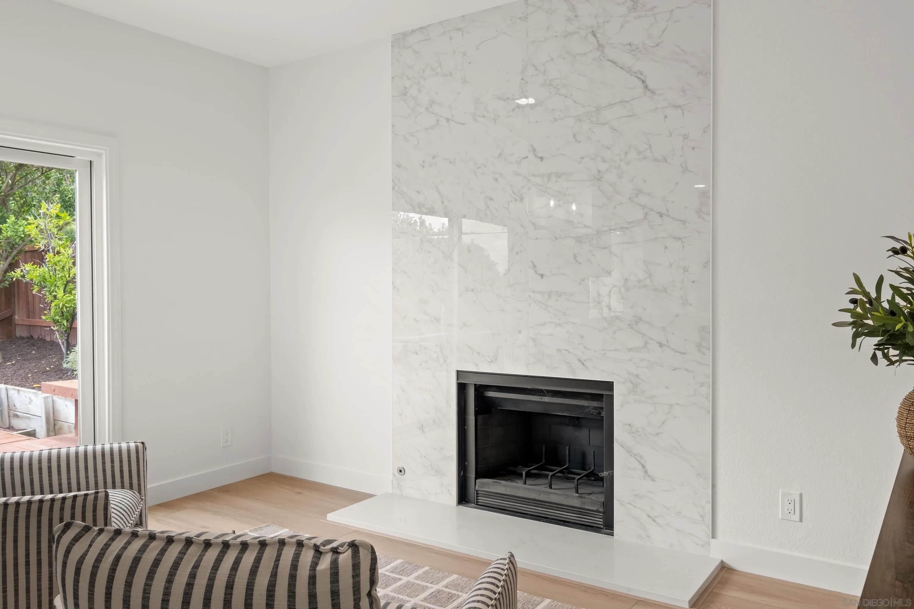 11478 Madera Rosa Way San Diego, CA 92124 - Photo 12 of 54 a bedroom with a bed and a fireplace