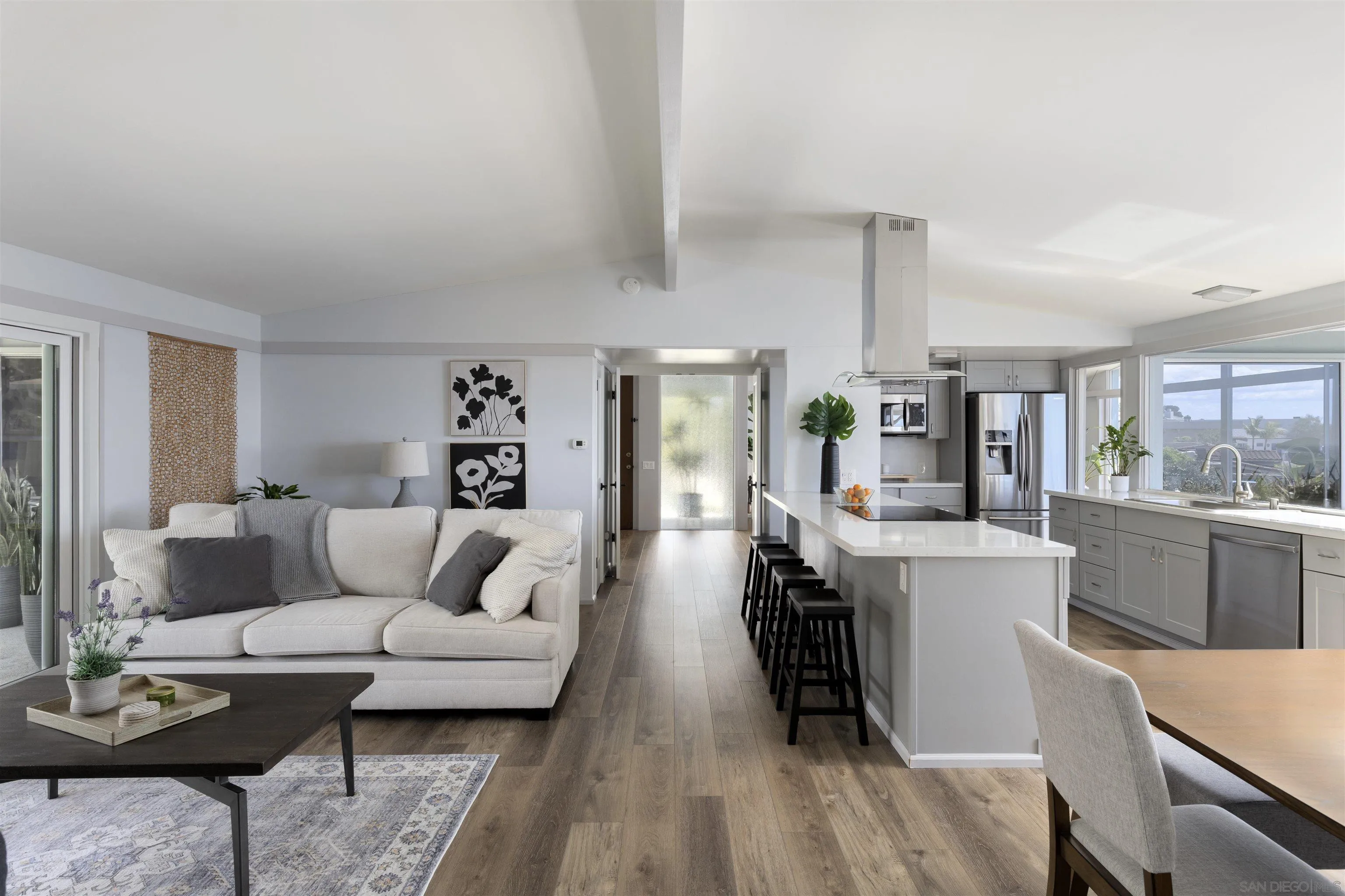 5502 Rutgers Road La Jolla, CA 92037 - Photo 12 of 28 a living room with furniture and wooden floor