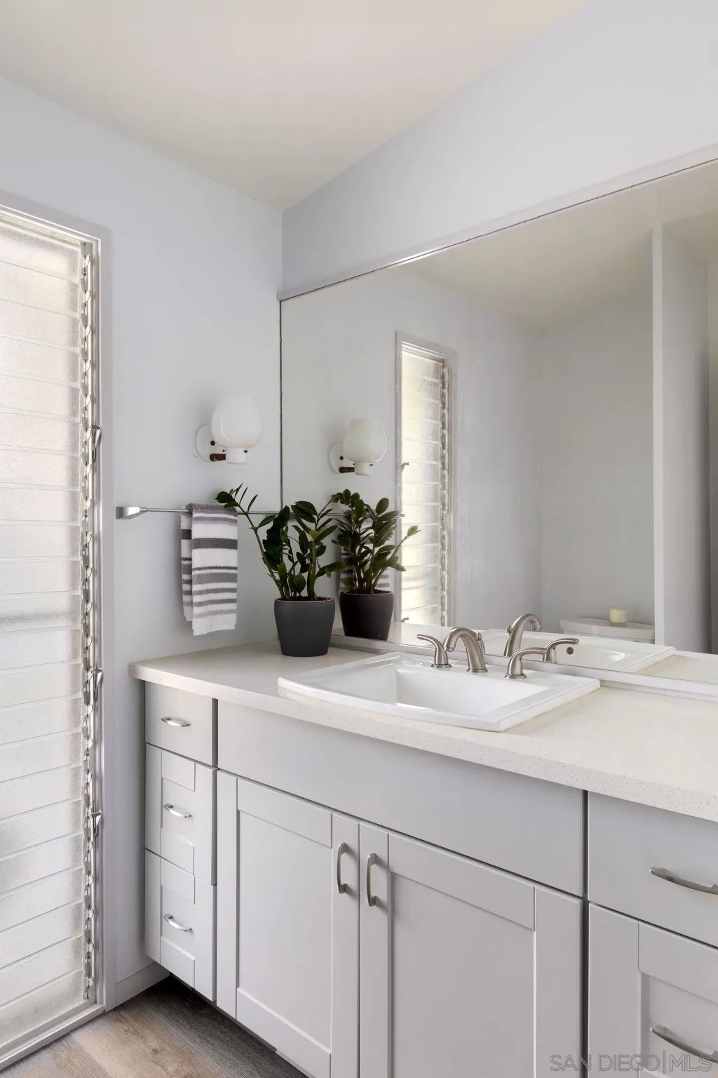 5502 Rutgers Road La Jolla, CA 92037 - Photo 19 of 28 a bathroom with a sink and a mirror