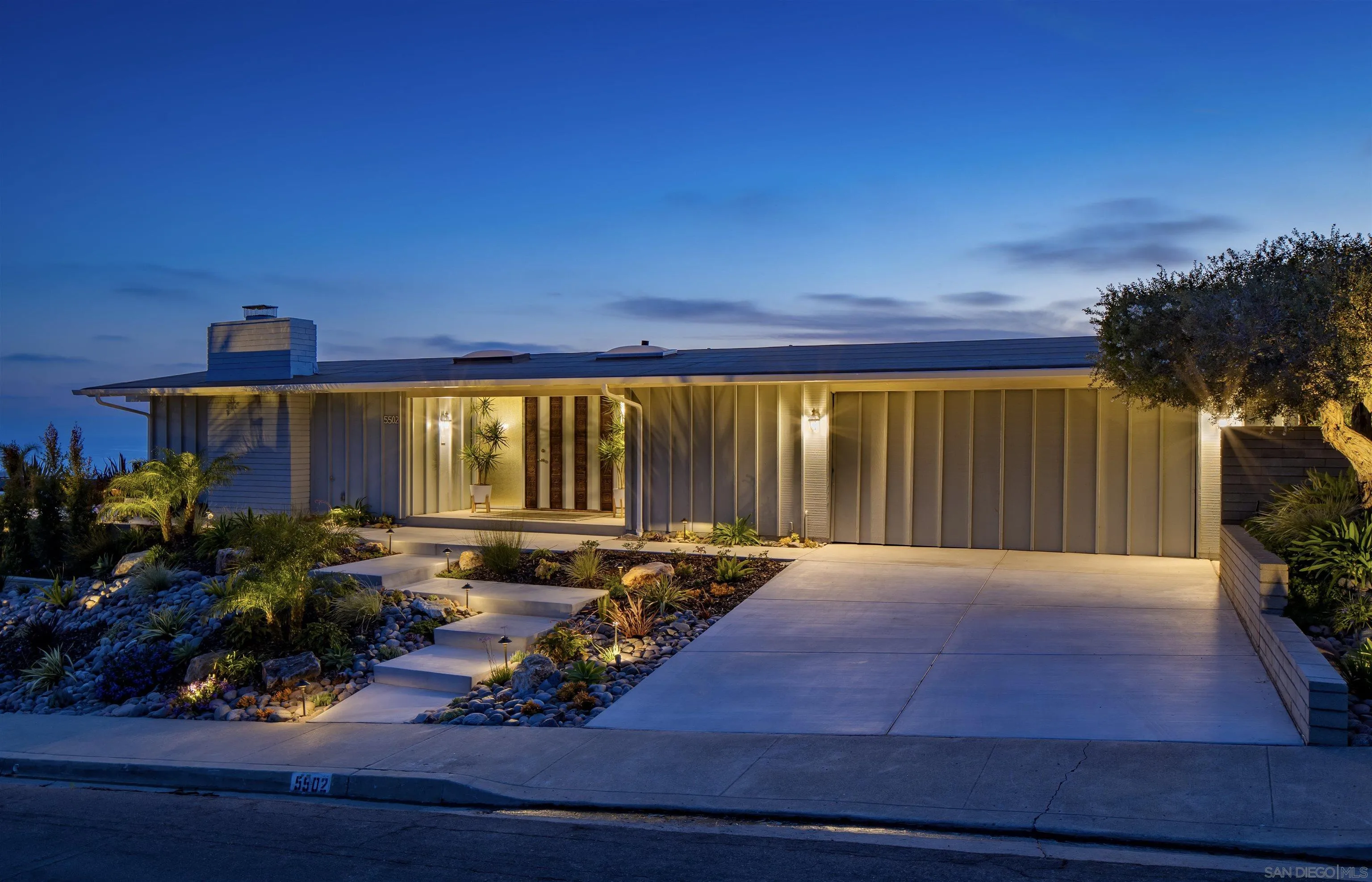 5502 Rutgers Road La Jolla, CA 92037 - Photo 2 of 28 a view of backyard with outdoor seating