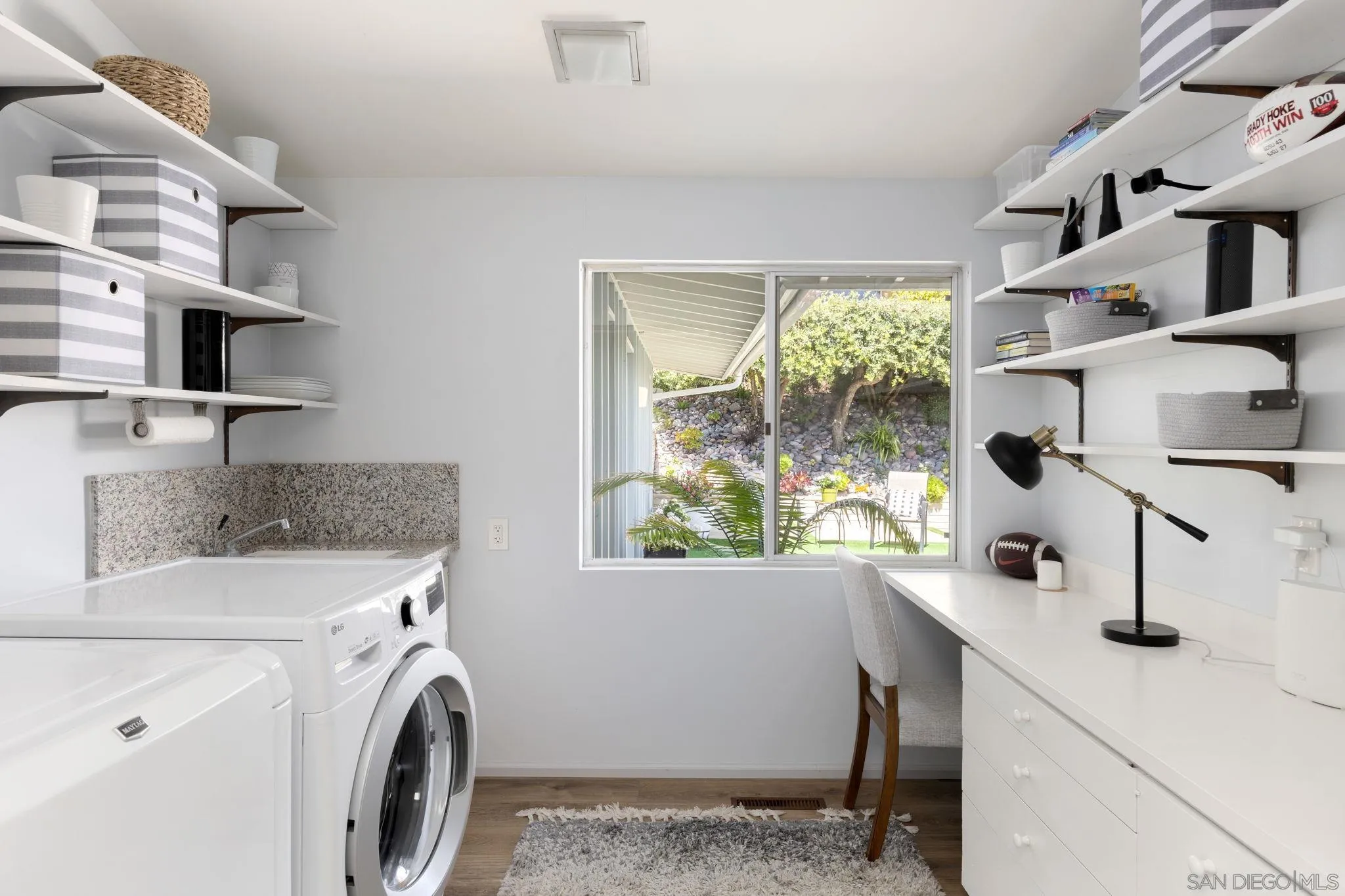 5502 Rutgers Road La Jolla, CA 92037 - Photo 22 of 28 a view of kitchen sink washer and dryer