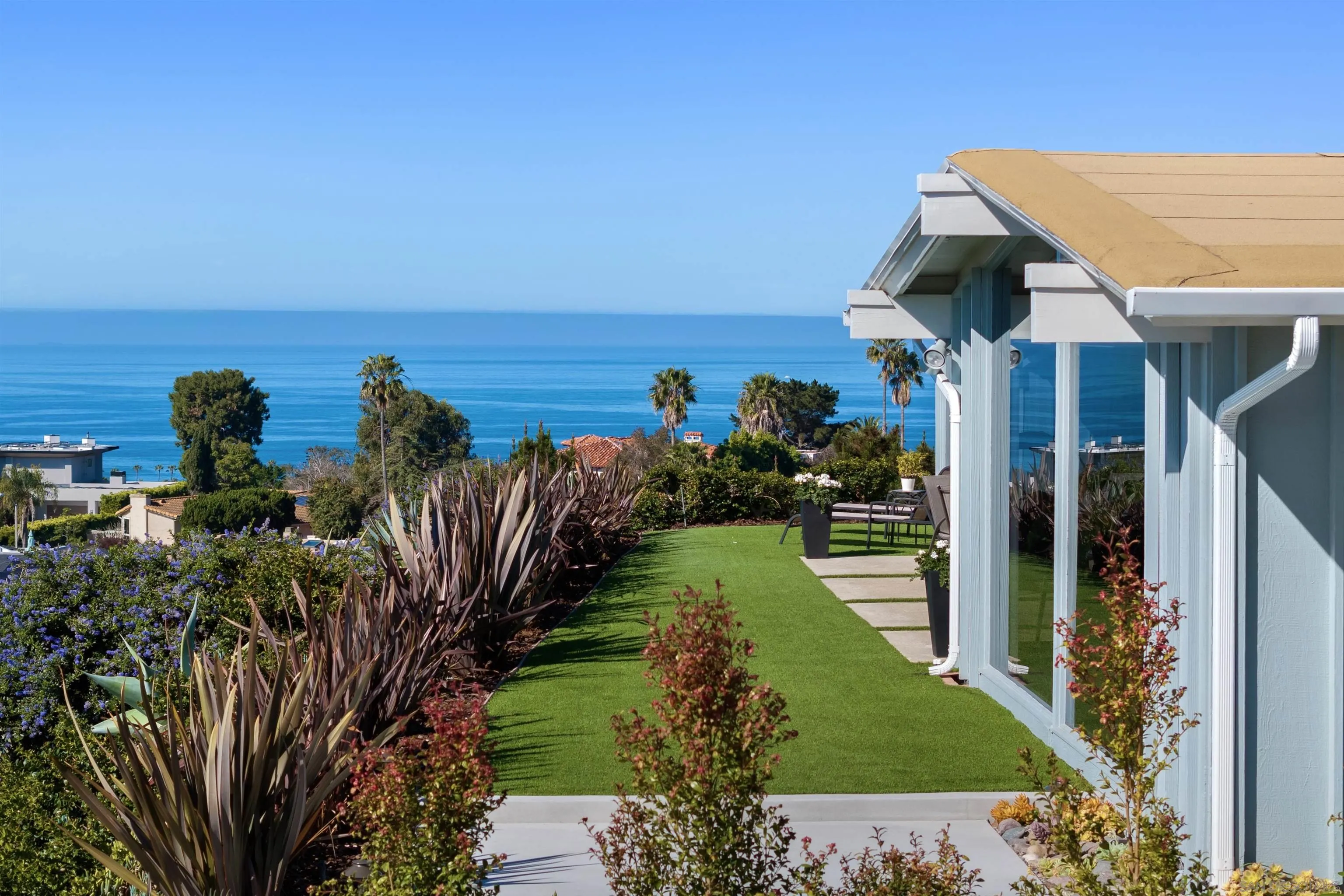 5502 Rutgers Road La Jolla, CA 92037 - Photo 3 of 28 a view of a house with a yard