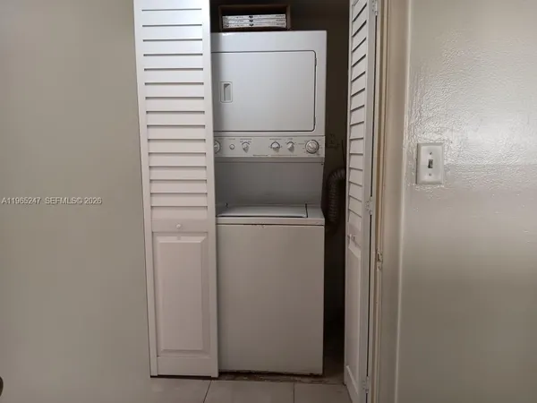 a view of swimming pool with outdoor seating and plants