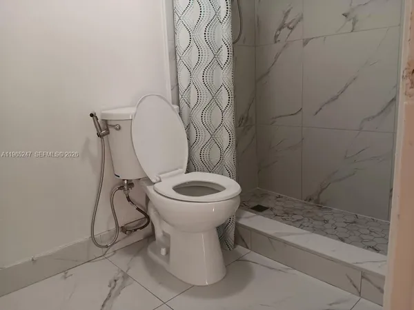 a bathroom with a toilet and a sink