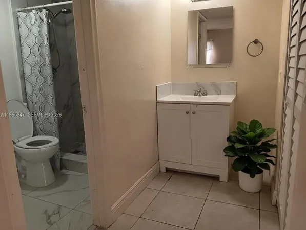 an empty room with window in a house