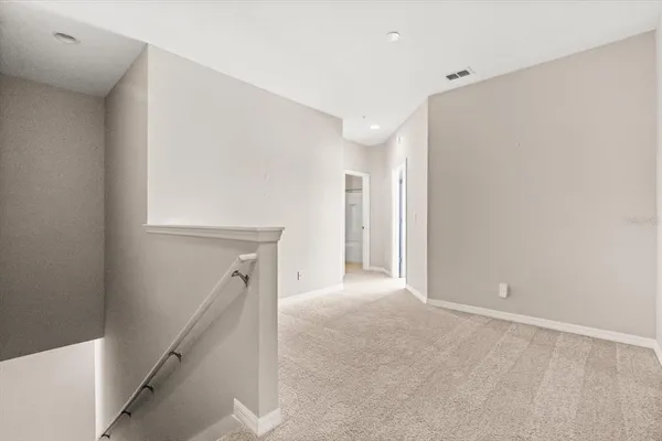 a view of hallway with stairs