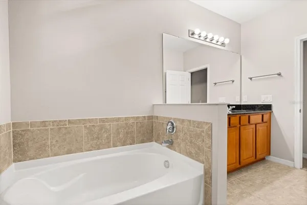 a bathroom with bathtub and a sink