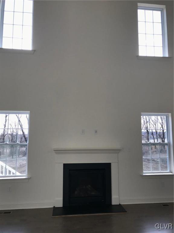309 Aubrey Road, Unit 18 Nazareth, PA 18064 - Photo 9 of 13 an empty room with windows and fireplace