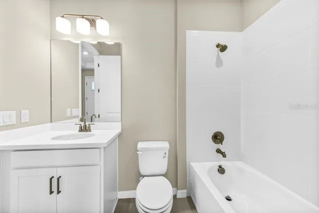 a bathroom with a double vanity sink a mirror and a shower