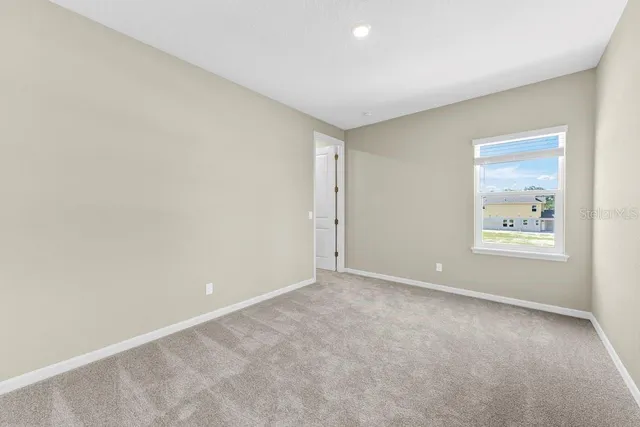 an empty room with closet area