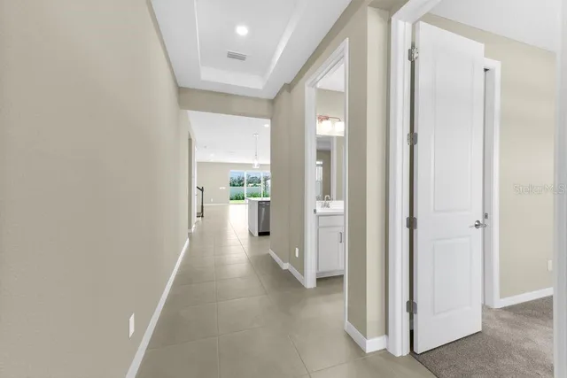 a view of a kitchen from the hallway