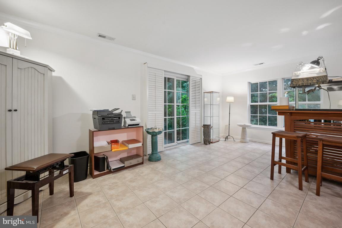 7706 Juniper Lane Palmyra, NJ 08065 - Photo 21 of 24 Den walk out patio to relax meditation garden