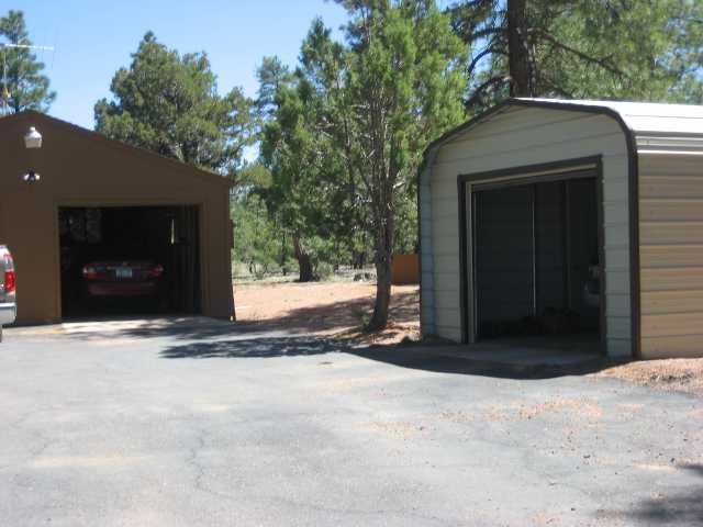 2039 Lone Mountain Road Overgaard, AZ 85933 - Photo 3 of 5 a view of entrance door of a house