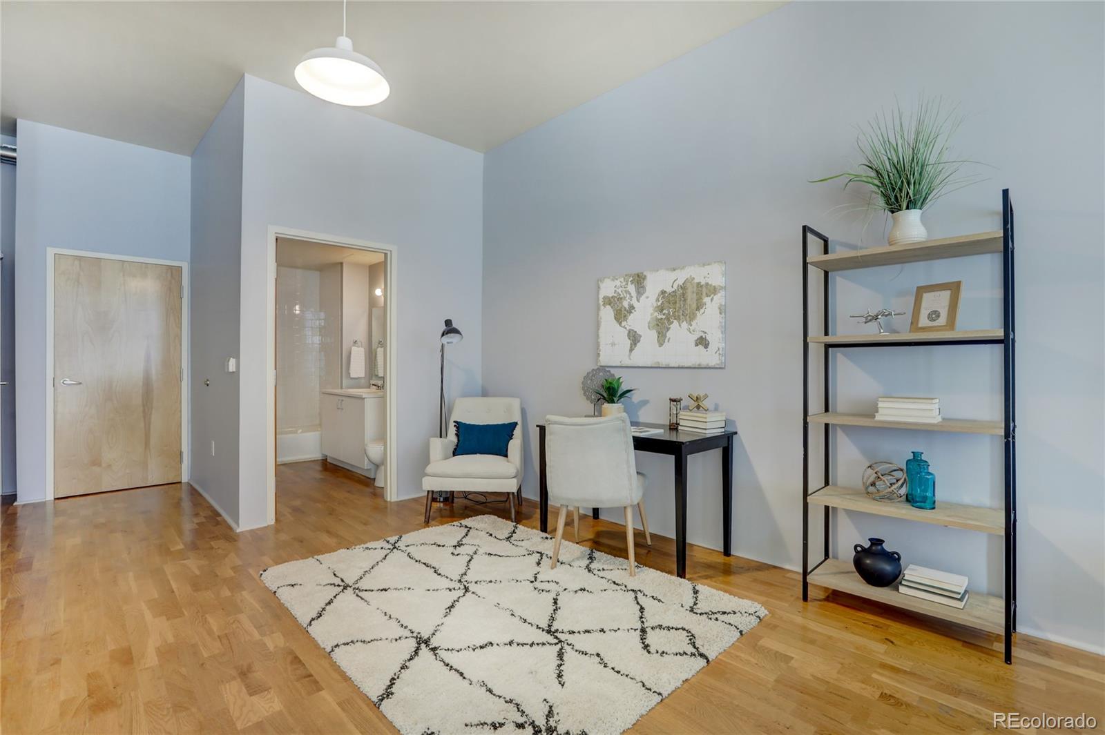 3100 Huron Street, Unit 2R Denver, CO 80202 - Photo 11 of 33 a living room with furniture and a potted plant