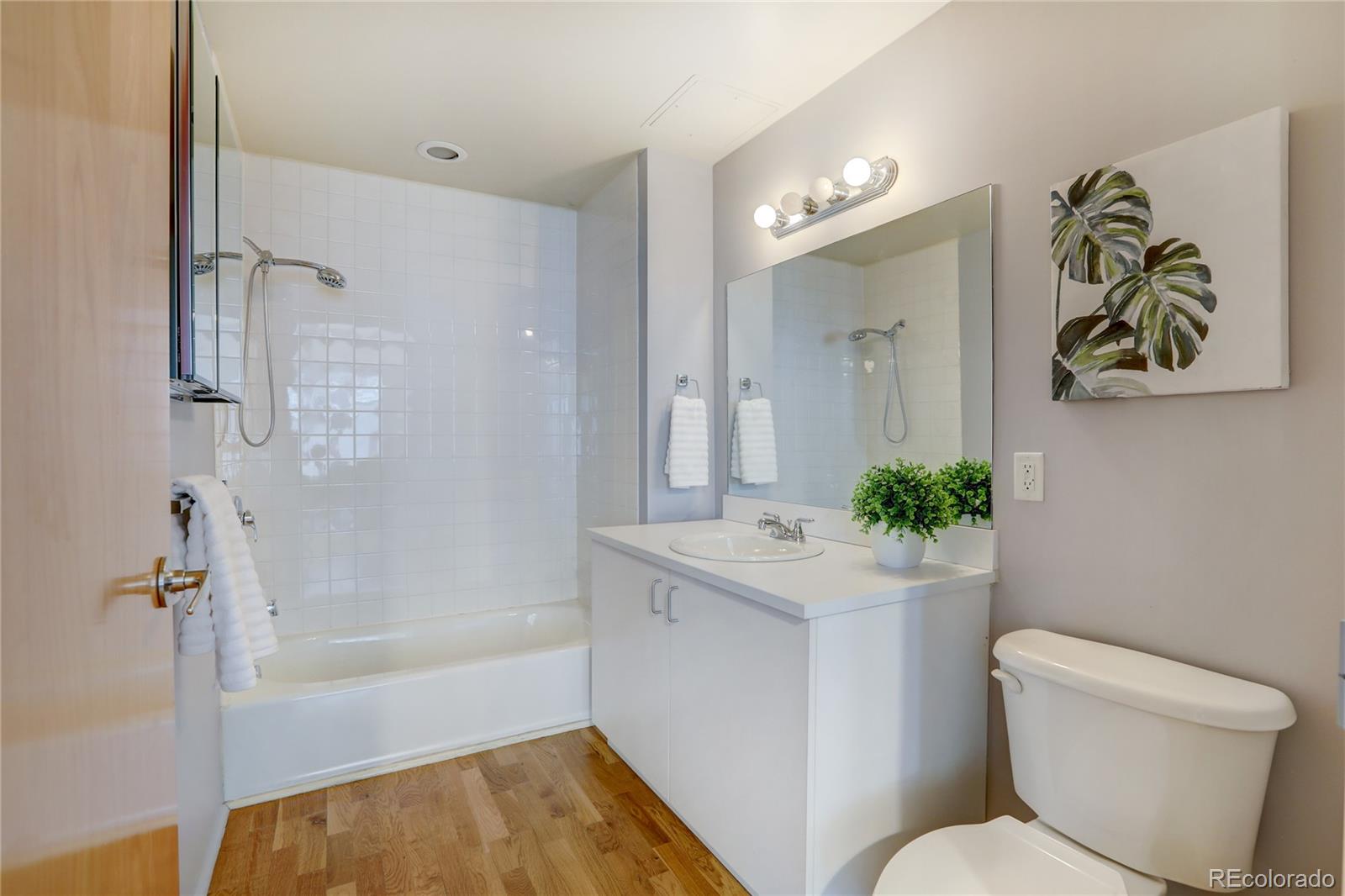 3100 Huron Street, Unit 2R Denver, CO 80202 - Photo 12 of 33 a bathroom with a toilet sink and bathtub