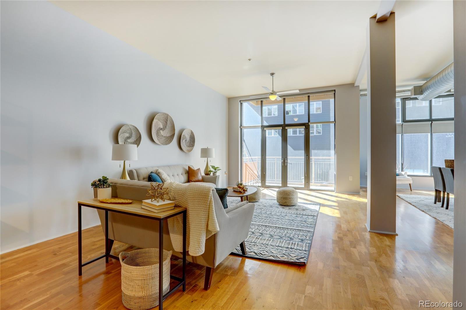 3100 Huron Street, Unit 2R Denver, CO 80202 - Photo 14 of 33 a living room with furniture and wooden floor