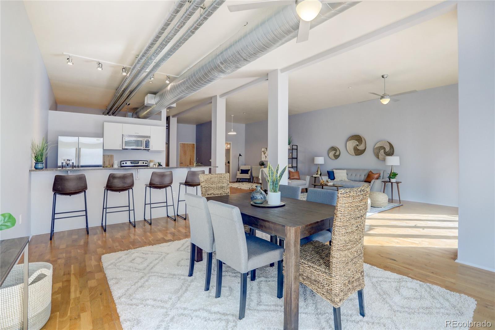 3100 Huron Street, Unit 2R Denver, CO 80202 - Photo 20 of 33 a view of a dining room with furniture