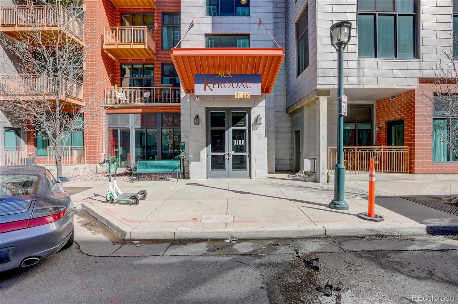3100 Huron Street, Unit 2R Denver, CO 80202 - Photo 31 of 33 a front view of a building with parking area
