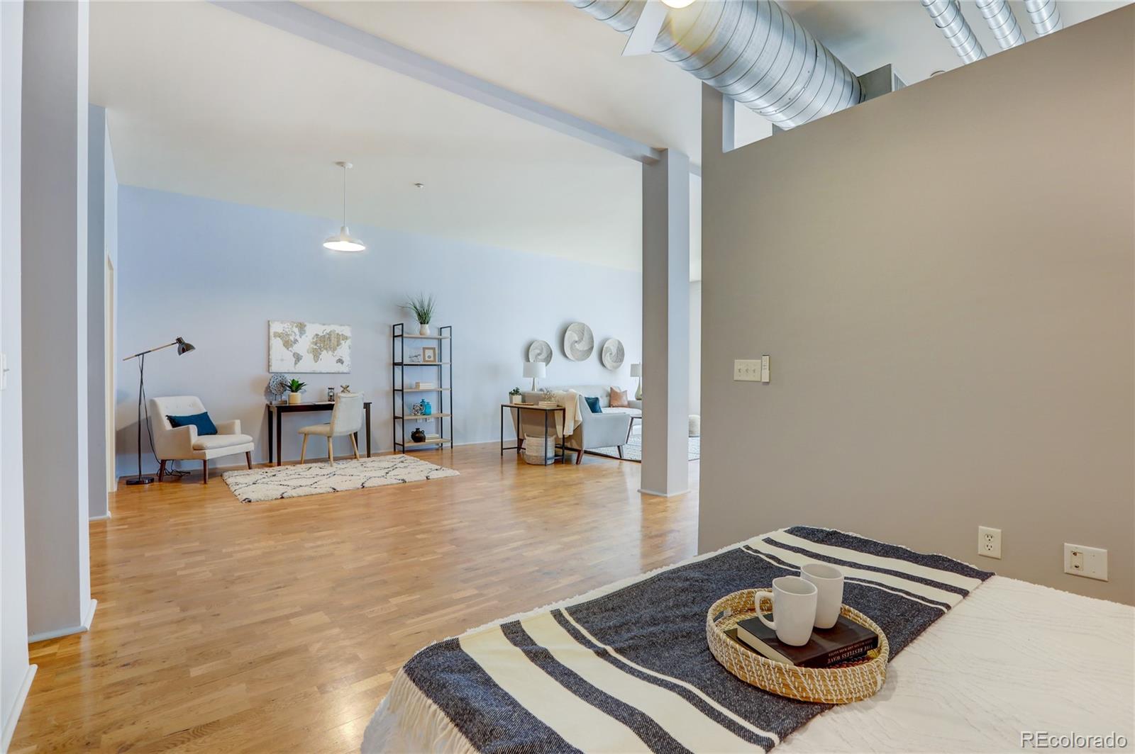 3100 Huron Street, Unit 2R Denver, CO 80202 - Photo 8 of 33 a room with furniture and gym equipment