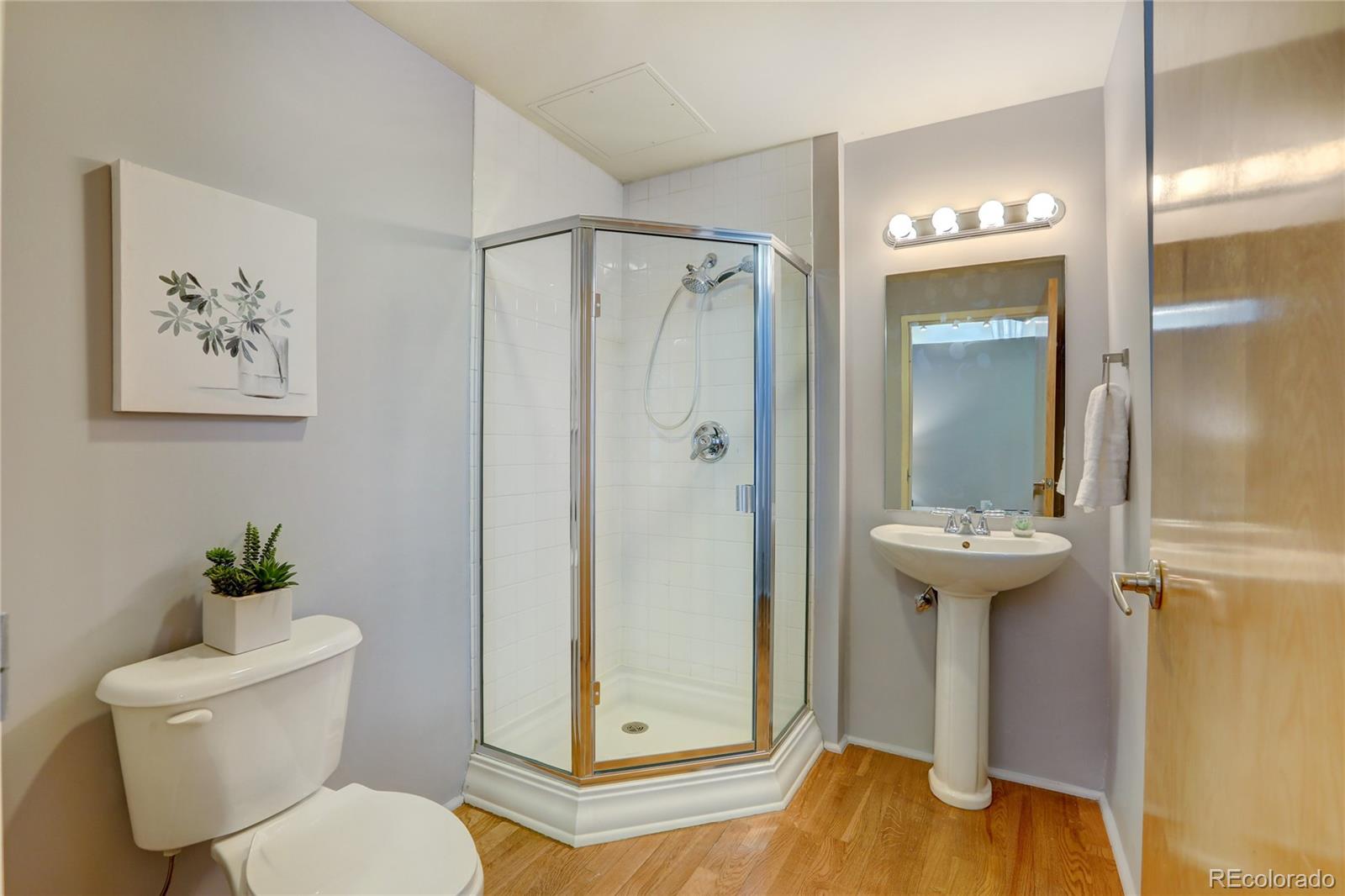 3100 Huron Street, Unit 2R Denver, CO 80202 - Photo 9 of 33 a bathroom with a toilet and a shower