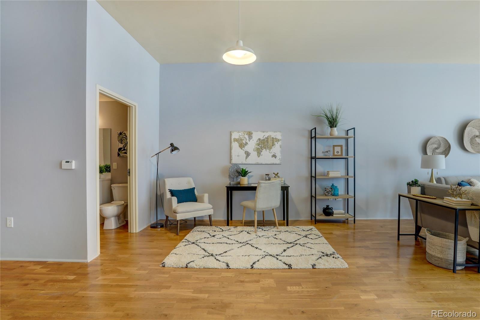 3100 Huron Street, Unit 2R Denver, CO 80202 - Photo 10 of 33 a bedroom with a bed and a table in it
