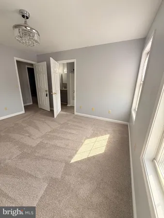 a view of an empty room with closet