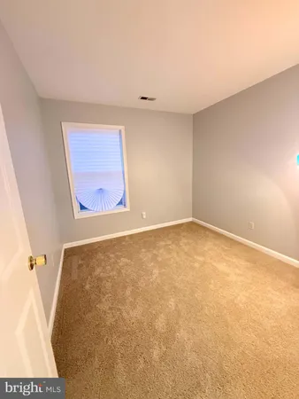 an empty room with a bench