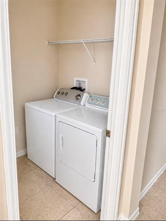 8253 Maritime Flag Street, Unit 109 Windermere, FL 34786 - Photo 13 of 23 a utility room with dryer and washer