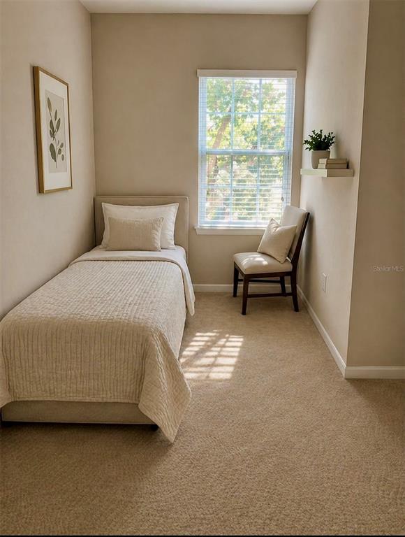 8253 Maritime Flag Street, Unit 109 Windermere, FL 34786 - Photo 16 of 23 a bedroom with a bed and a window