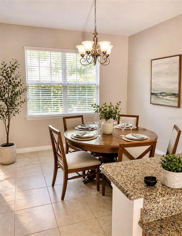 8253 Maritime Flag Street, Unit 109 Windermere, FL 34786 - Photo 8 of 23 a dining room with furniture and window
